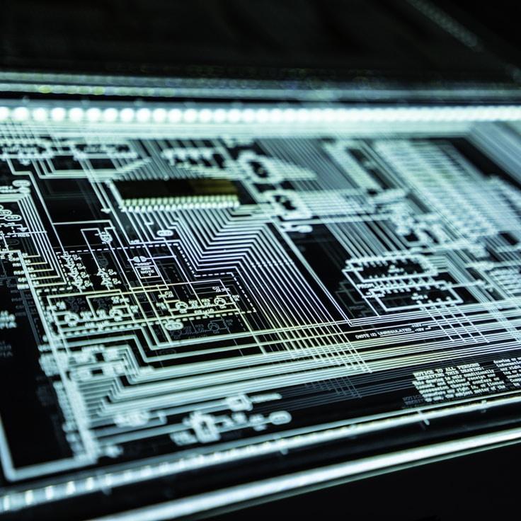 Mobile app project planning workspace with devices and development tools
